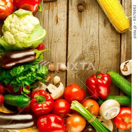 Healthy Organic Vegetables on a Wood Background 6976662