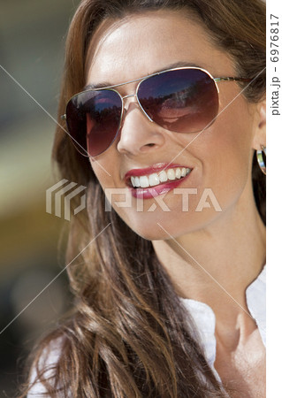 Portrait of A Beautiful Young Woman Wearing Aviator Sunglasses Portrait of A Beautiful Young Woman Wearing Aviator Sunglasses 6976817