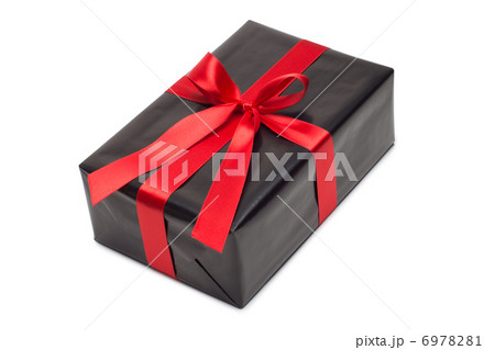 Black gift box with red satin ribbon and bow, over white background. 6978281