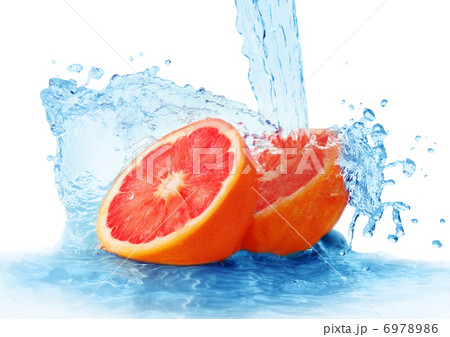 grapefruit in a spray of water grapefruit in a spray of water 6978986