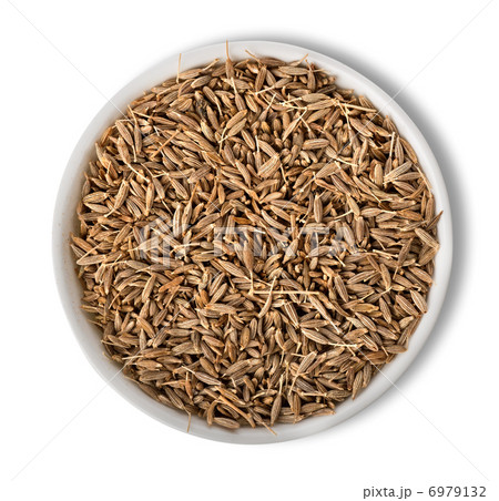 Cumin in plate isolated Cumin in plate isolated 6979132
