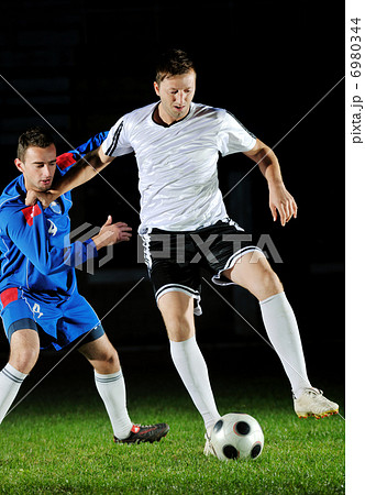 football players in action for the ball football players in action for the ball 6980344