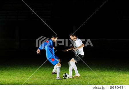 football players in action for the ball football players in action for the ball 6980434