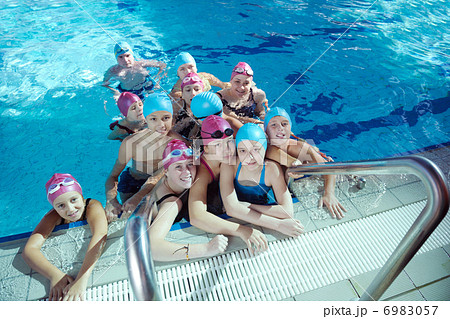 happy children group at swimming pool 6983057