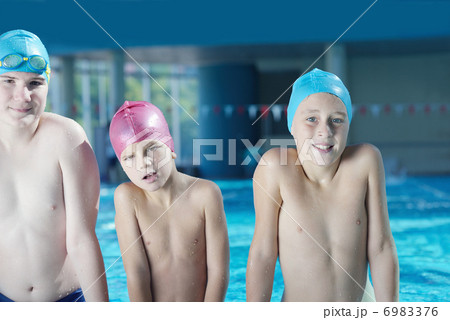 happy children group at swimming pool 6983376