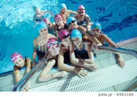 happy children group at swimming pool 6983380