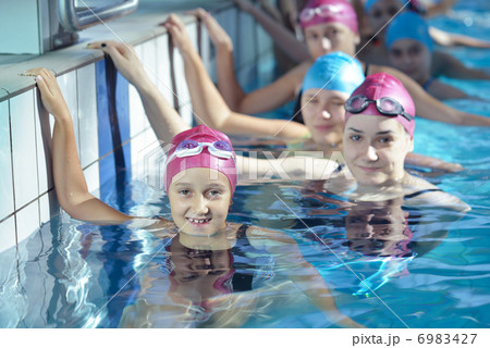 happy children group at swimming pool 6983427