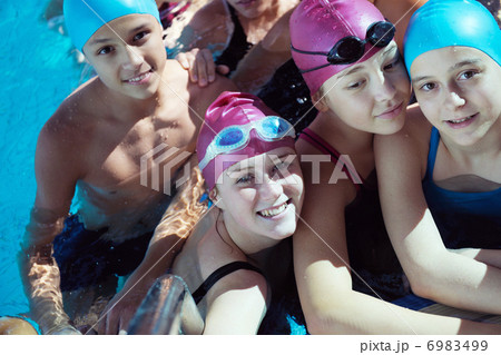 happy children group at swimming pool 6983499