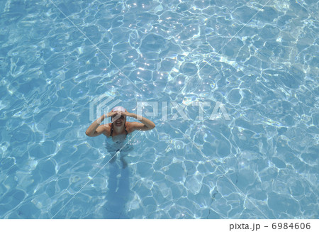 woman relax at swimming pool woman relax at swimming pool 6984606