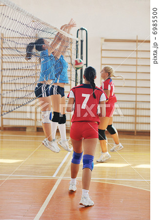 girls playing volleyball indoor game girls playing volleyball indoor game 6985500
