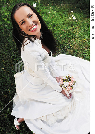 beautiful bride outdoor after wedding ceremny 6986349
