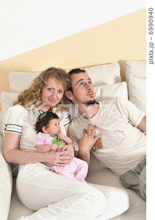 indoor portrait with happy young family and cute little babby indoor portrait with happy young family and cute little babby 6990940