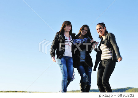 group of teens have fun outdoor group of teens have fun outdoor 6991802