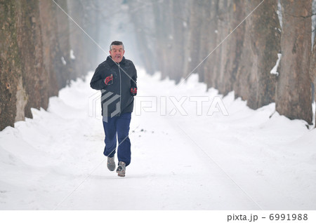 one older man running at alley one older man running at alley 6991988