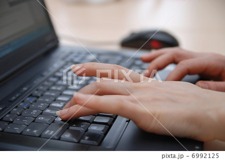woman hands typing on laptop keyboard woman hands typing on laptop keyboard 6992125
