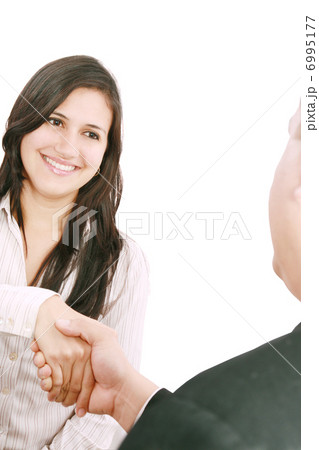 Closeup of business people shaking hands over a deal at office - Closeup of business people shaking hands over a deal at office - 6995177