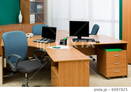computer and laptop on a desk 6997825