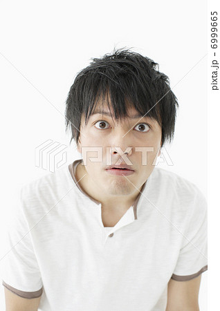 驚き顔の日本人男性の写真素材