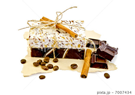Soap homemade with chocolate and cinnamon on paper Soap homemade with chocolate and cinnamon on paper 7007434