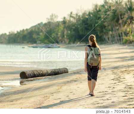 Young woman hiking with backpack Young woman hiking with backpack 7014543