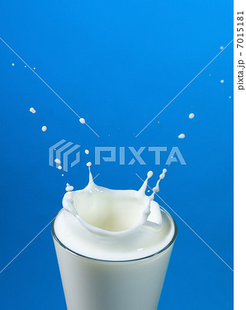 pouring milk in a glass isolated pouring milk in a glass isolated 7015181