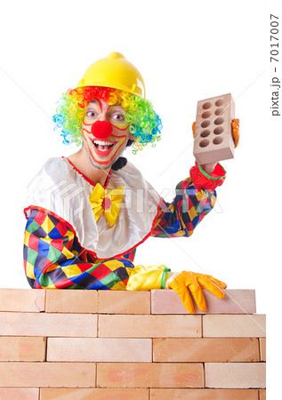 Bad construction concept with clown laying bricks 7017007