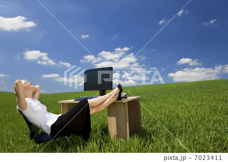 Woman Relaxing In a Green Office Woman Relaxing In a Green Office 7023411
