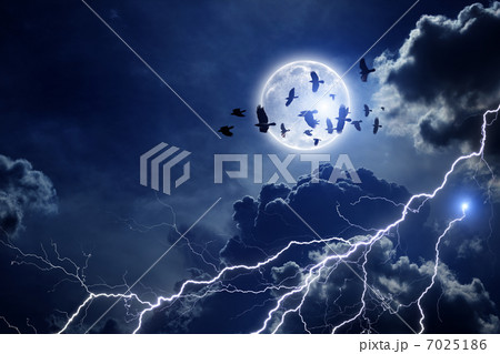Stormy sky, flock of ravens 7025186