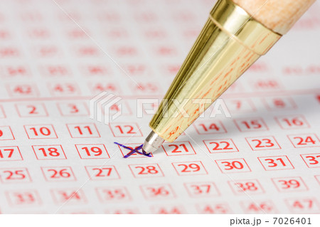 Lottery ticket with a marked number and a pen 7026401