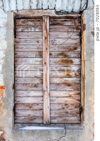 old house with boarded up window old house with boarded up window 7028063