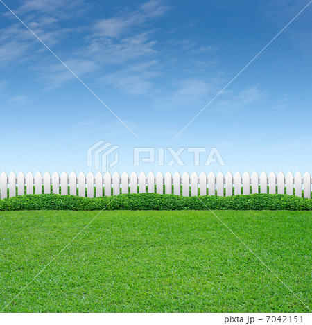 White fence and green grass 7042151