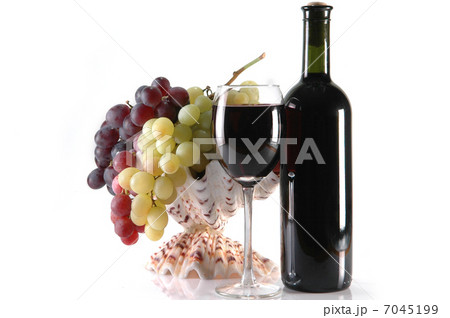 different grapes and glass of wine on whie 7045199