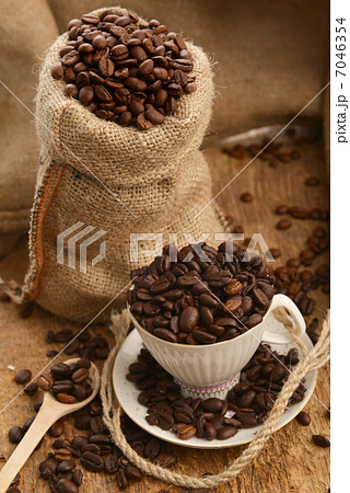 Coffee beans and cup Coffee beans and cup 7046354
