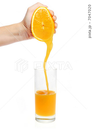 Woman Hand Pour Orange Juiceの写真素材