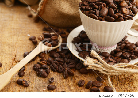 Coffee beans and cup 7047756