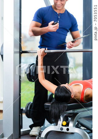 woman and Personal Trainer in gym woman and Personal Trainer in gym 7053551