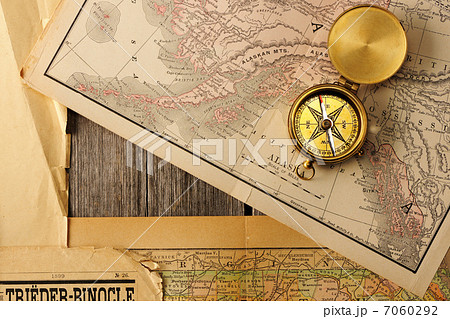 Antique compass over old map Antique compass over old map 7060292