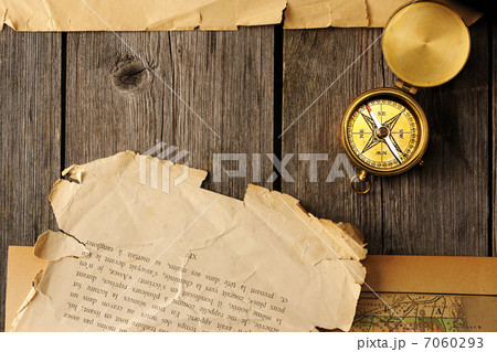 Antique compass over old map Antique compass over old map 7060293