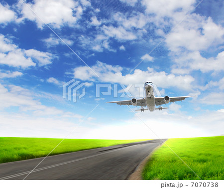 Airplane in blue cloudy sky 7070738
