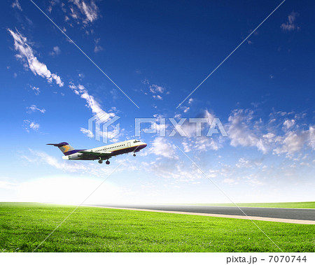 Airplane in blue cloudy sky Airplane in blue cloudy sky 7070744