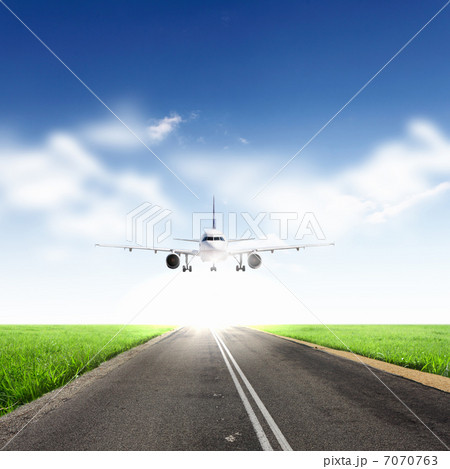 Airplane in blue cloudy sky Airplane in blue cloudy sky 7070763