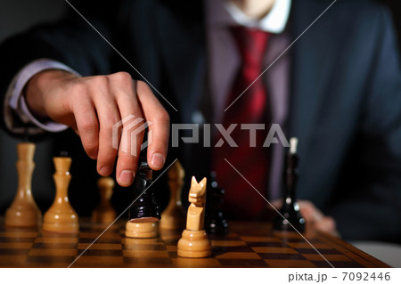 Businessman playing chess Businessman playing chess 7092446