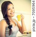 Cafe woman drinking orange juice 7095964