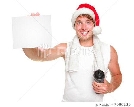 Christmas fitness man showing gift card 7096139