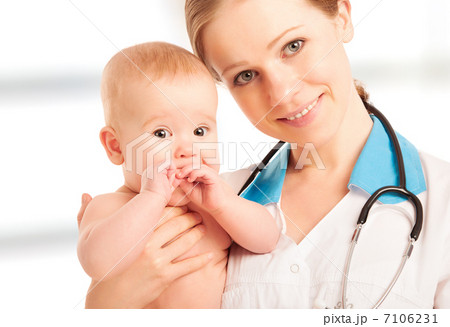 Pediatrician woman doctor holding baby 7106231