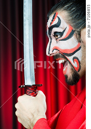 Man with sword and face mask 7106855