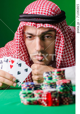 Arab playing in casino - gambling concept with man 7106865