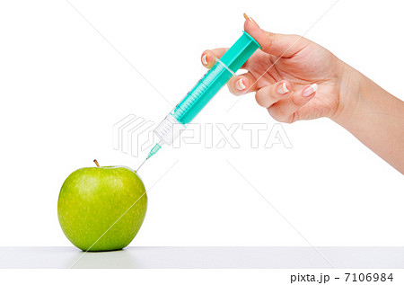 Chemical experiment with apple and syringe Chemical experiment with apple and syringe 7106984