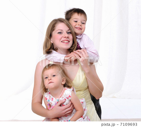 Mom, her son and her little daughter Mom, her son and her little daughter 7109693