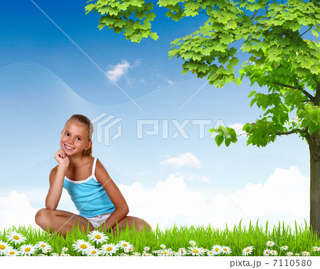 Smiling girl on green grass Smiling girl on green grass 7110580